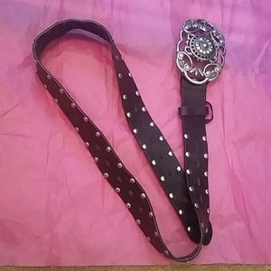 Black and studded woman's belt with belt buckle